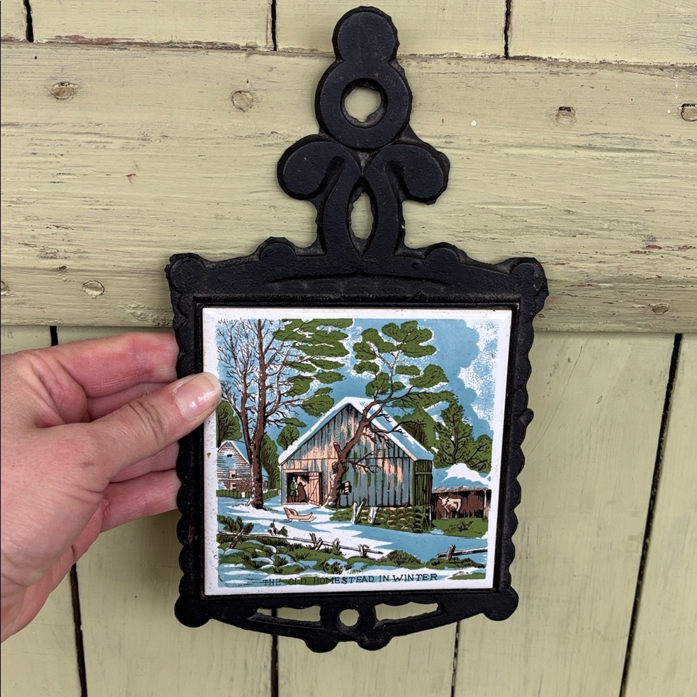 Vintage winter scene cast iron and ceramic tile trivet